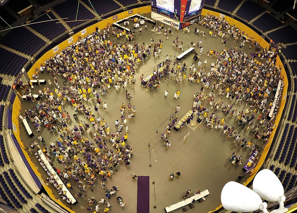 Aerial view of a packed arena event with the floor laid out and carpeted by Gulf Coast Event Services